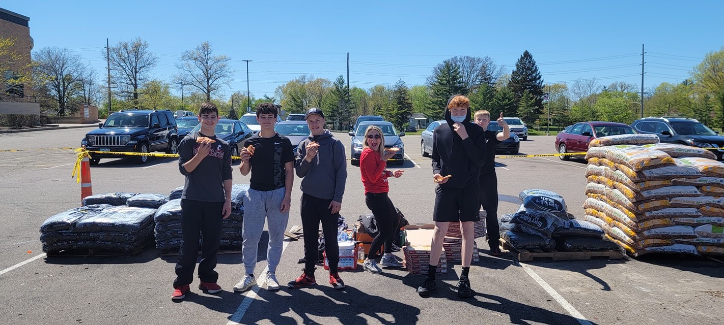 photo of football players selling mulch